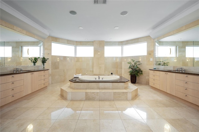 3425 Saddlebrook Ln, Weston, FL 33331 - full bath featuring tile walls, two vanities, a sink, and a bath