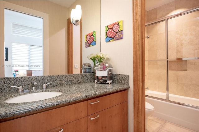 3425 Saddlebrook Ln, Weston, FL 33331 - full bathroom featuring toilet, tile patterned floors, combined bath / shower with glass door, and vanity