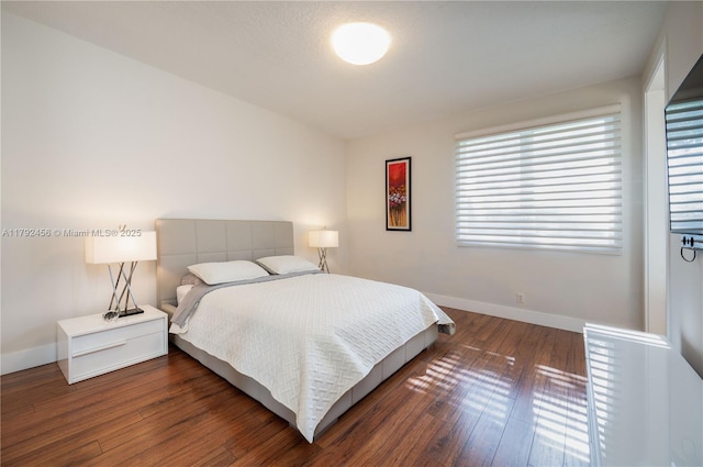 3425 Saddlebrook Ln, Weston, FL 33331 - bedroom with baseboards and wood finished floors