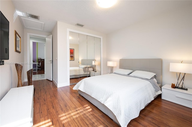 3425 Saddlebrook Ln, Weston, FL 33331 - bedroom with baseboards, a closet, wood finished floors, and visible vents
