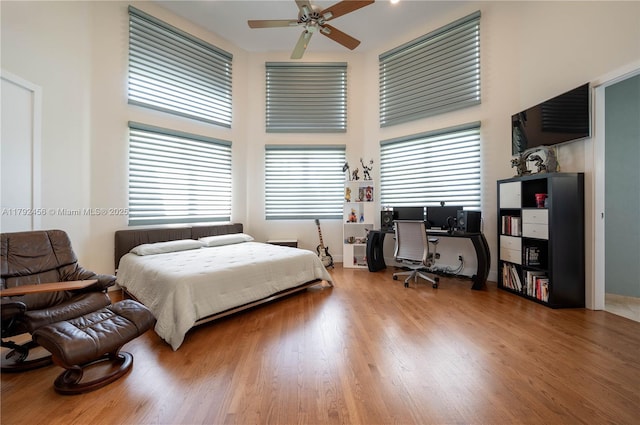 3425 Saddlebrook Ln, Weston, FL 33331 - bedroom featuring wood finished floors, ceiling fan, and a high ceiling