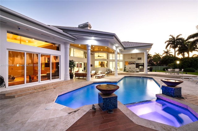 3425 Saddlebrook Ln, Weston, FL 33331 - rear view of property featuring a pool with connected hot tub, a chimney, an outdoor living space, a patio area, and a ceiling fan