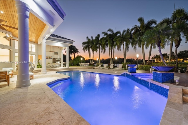 3425 Saddlebrook Ln, Weston, FL 33331 - pool at dusk featuring ceiling fan, a patio area, and an outdoor pool