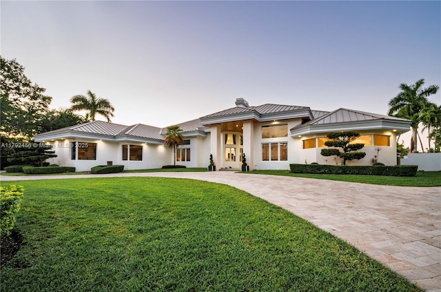 3425 Saddlebrook Ln, Weston, FL 33331 - prairie-style home featuring decorative driveway, a standing seam roof, metal roof, and a chimney