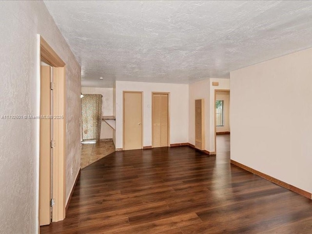 19357 NW 29th Ave, Miami Gardens, FL 33056 - empty room featuring wood finished floors, baseboards, and a textured ceiling