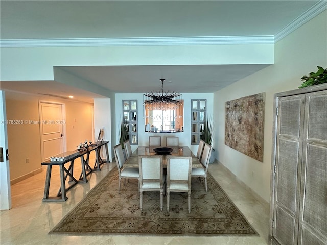 dining room featuring ornamental molding and a notable chandelier