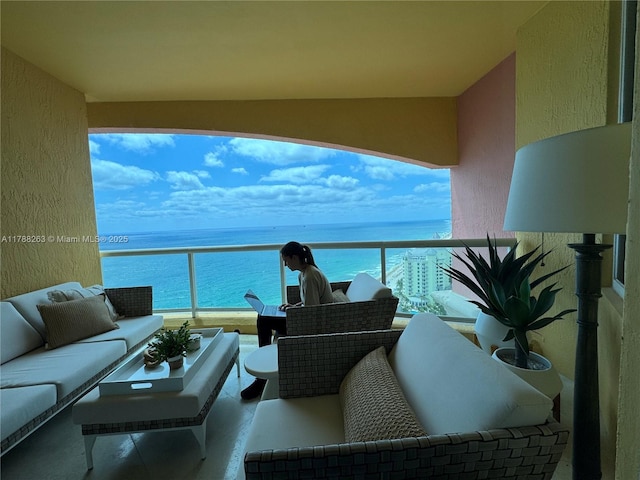 balcony featuring a water view