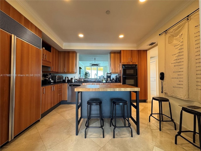 kitchen with a kitchen bar, brown cabinetry, paneled refrigerator, dishwasher, and dobule oven black