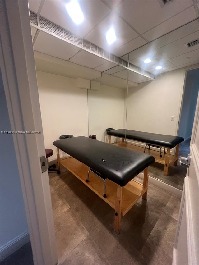 game room with visible vents and a drop ceiling