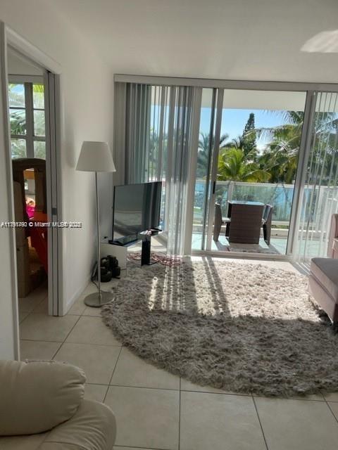 5161 Collins Ave Unit 506, Miami Beach, FL 33140 - living room with tile patterned flooring