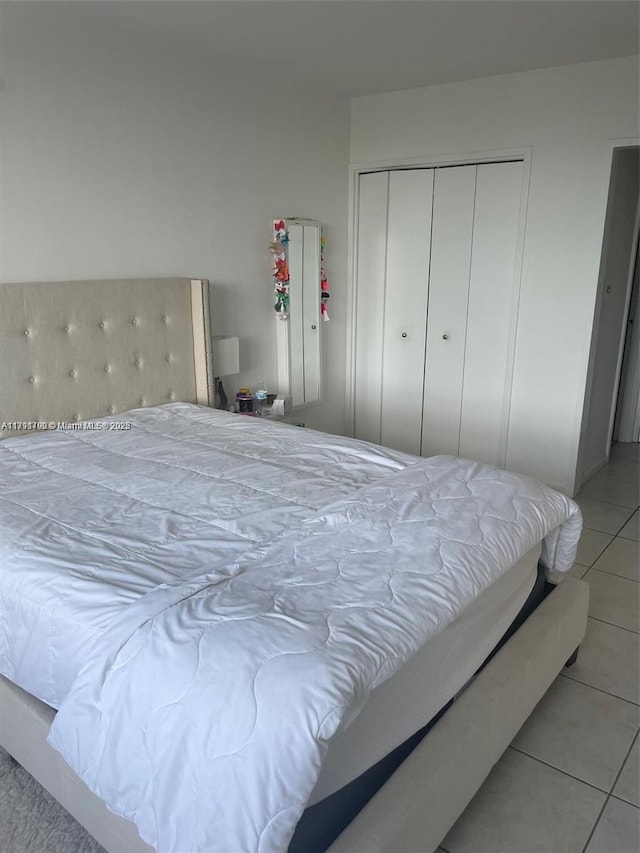 5161 Collins Ave Unit 506, Miami Beach, FL 33140 - bedroom with light tile patterned floors and a closet