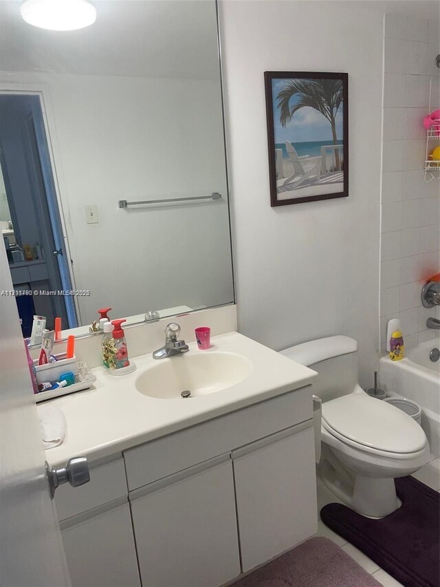 5161 Collins Ave Unit 506, Miami Beach, FL 33140 - bathroom featuring tile patterned floors, toilet, shower / washtub combination, and vanity