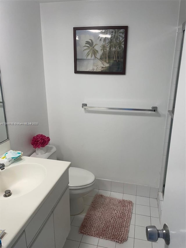 5161 Collins Ave Unit 506, Miami Beach, FL 33140 - bathroom featuring toilet, tile patterned flooring, and vanity