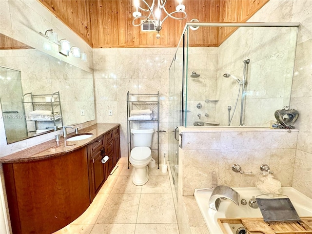 3699 Lakeview Blvd, Delray Beach, FL 33445 - full bathroom with a garden tub, tile walls, a shower stall, vanity, and a notable chandelier