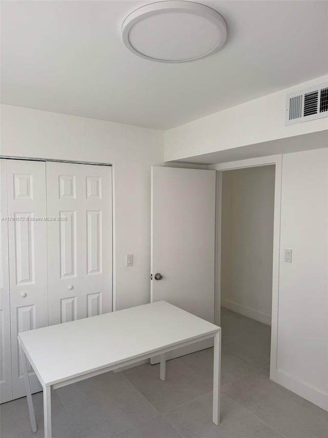 2939 Indian Creek Dr Unit 307, Miami Beach, FL 33140 - office space with light tile patterned flooring, baseboards, and visible vents