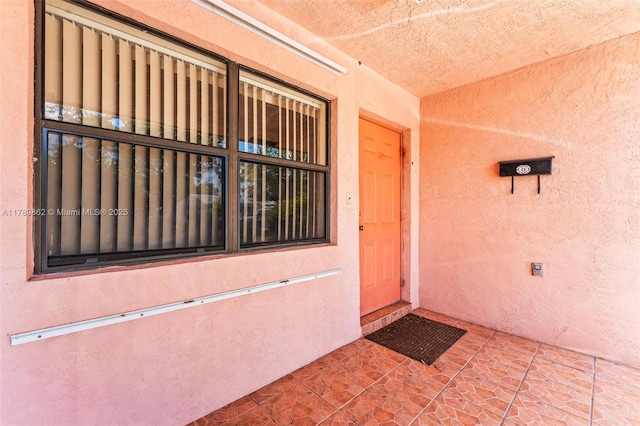 744 NW 7th St, Hallandale Beach, FL 33009 - view of exterior entry with stucco siding