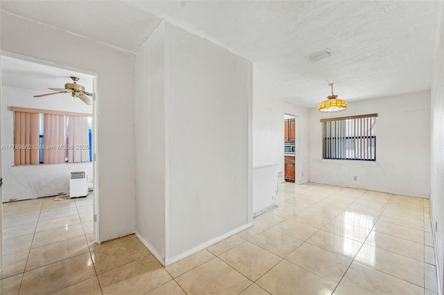 744 NW 7th St, Hallandale Beach, FL 33009 - unfurnished room with light tile patterned flooring, a ceiling fan, visible vents, and a textured ceiling