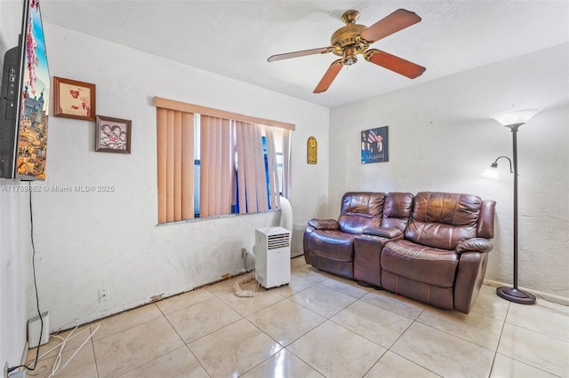 744 NW 7th St, Hallandale Beach, FL 33009 - living area with ceiling fan and light tile patterned flooring