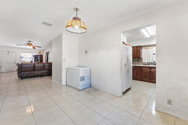 744 NW 7th St, Hallandale Beach, FL 33009 - unfurnished dining area featuring baseboards, ceiling fan, visible vents, and light tile patterned floors