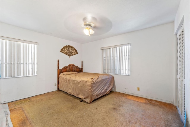 744 NW 7th St, Hallandale Beach, FL 33009 - carpeted bedroom with multiple windows, a closet, and ceiling fan