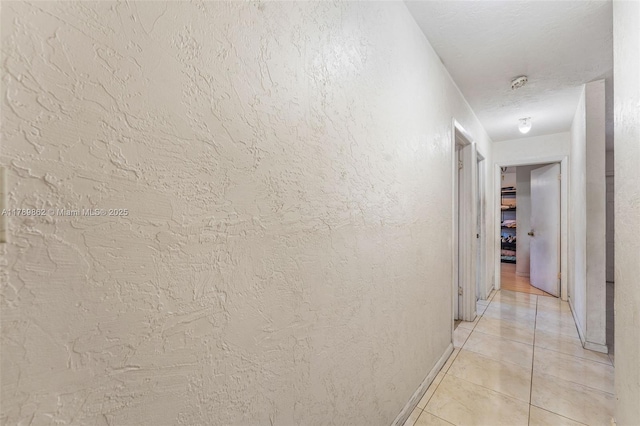 744 NW 7th St, Hallandale Beach, FL 33009 - hall featuring baseboards and light tile patterned flooring