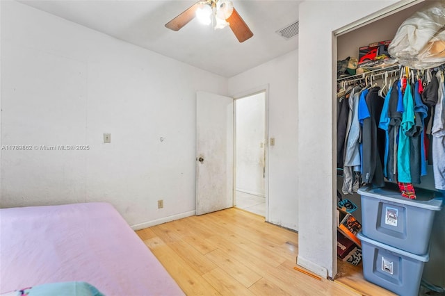 744 NW 7th St, Hallandale Beach, FL 33009 - bedroom featuring ceiling fan, baseboards, wood finished floors, visible vents, and a closet