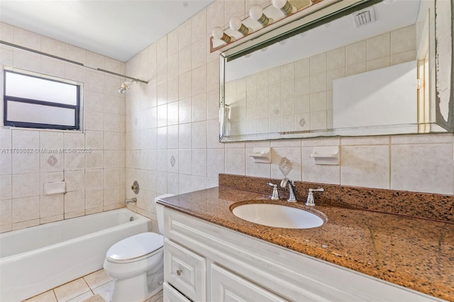 744 NW 7th St, Hallandale Beach, FL 33009 - full bathroom featuring vanity, bathing tub / shower combination, toilet, tile walls, and tile patterned floors