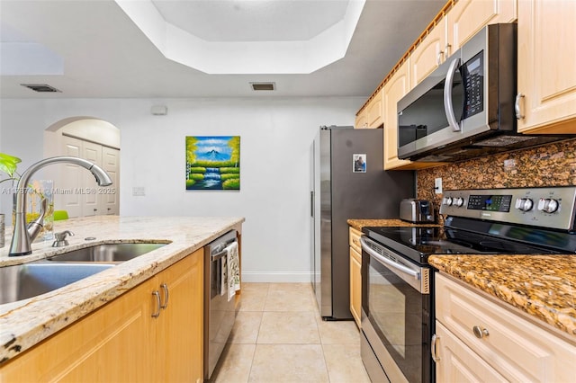 4971 Leeward Ln Unit 3004, Dania Beach, FL 33312 - kitchen with a raised ceiling, light stone countertops, stainless steel appliances, and visible vents