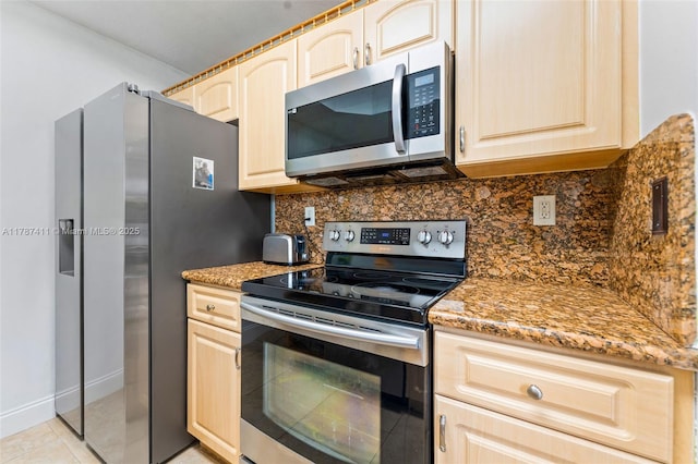 4971 Leeward Ln Unit 3004, Dania Beach, FL 33312 - kitchen featuring stainless steel appliances, tasteful backsplash, light stone countertops, and light brown cabinetry