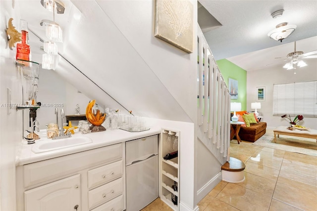 4971 Leeward Ln Unit 3004, Dania Beach, FL 33312 - bar featuring a ceiling fan, baseboards, light tile patterned floors, and a sink