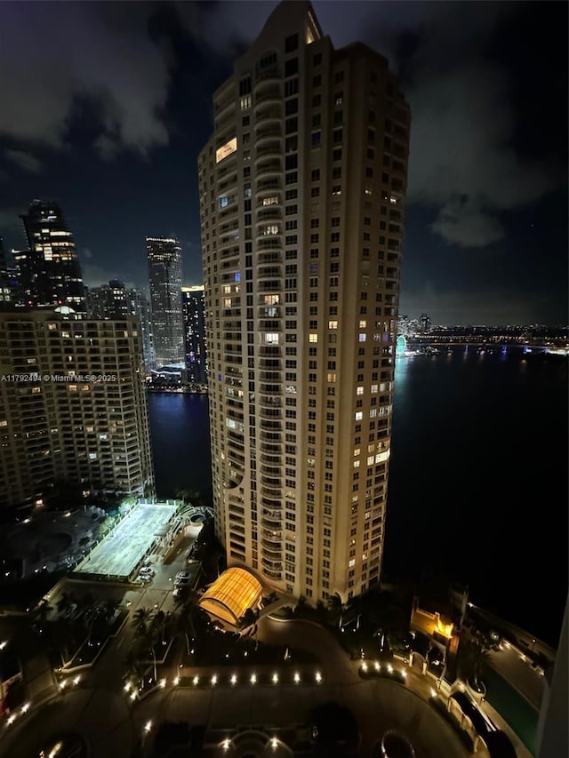 808 Brickell Key Dr Unit 3007, Miami, FL 33131 - property at night featuring a view of city lights and a water view