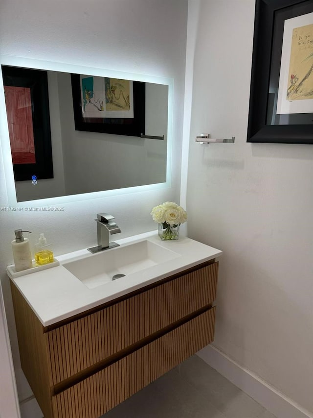 808 Brickell Key Dr Unit 3007, Miami, FL 33131 - bathroom with vanity, baseboards, and tile patterned floors