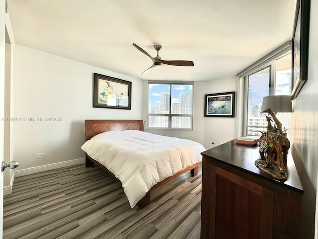 808 Brickell Key Dr Unit 3007, Miami, FL 33131 - bedroom with dark wood-type flooring, baseboards, and a ceiling fan