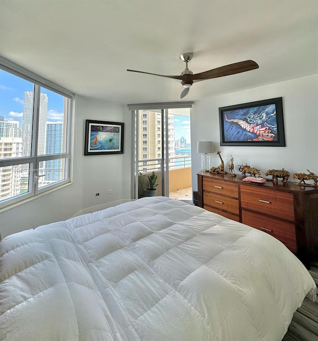 808 Brickell Key Dr Unit 3007, Miami, FL 33131 - bedroom featuring multiple windows and ceiling fan