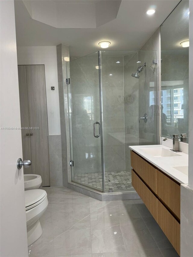 808 Brickell Key Dr Unit 3007, Miami, FL 33131 - full bathroom with toilet, a stall shower, a bidet, and vanity
