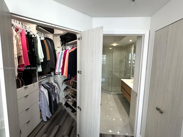 808 Brickell Key Dr Unit 3007, Miami, FL 33131 - full bathroom featuring vanity, a stall shower, and a spacious closet