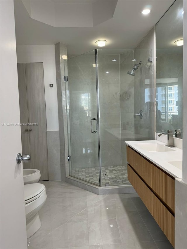 808 Brickell Key Dr Unit 3007, Miami, FL 33131 - full bathroom with toilet, a stall shower, vanity, and a bidet
