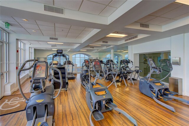 808 Brickell Key Dr Unit 3007, Miami, FL 33131 - exercise room with wood finished floors and a paneled ceiling