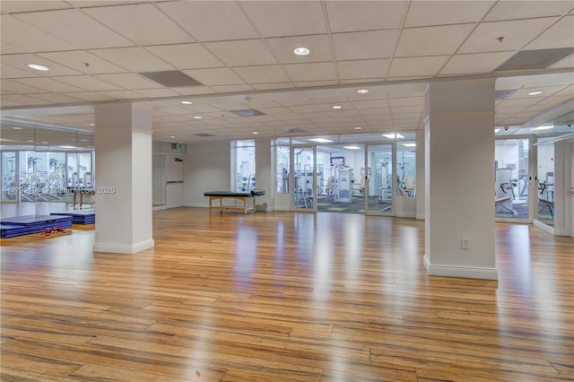 808 Brickell Key Dr Unit 3007, Miami, FL 33131 - gym featuring wood finished floors, baseboards, and a paneled ceiling