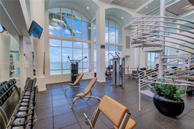 808 Brickell Key Dr Unit 3007, Miami, FL 33131 - workout area featuring a high ceiling, baseboards, and recessed lighting