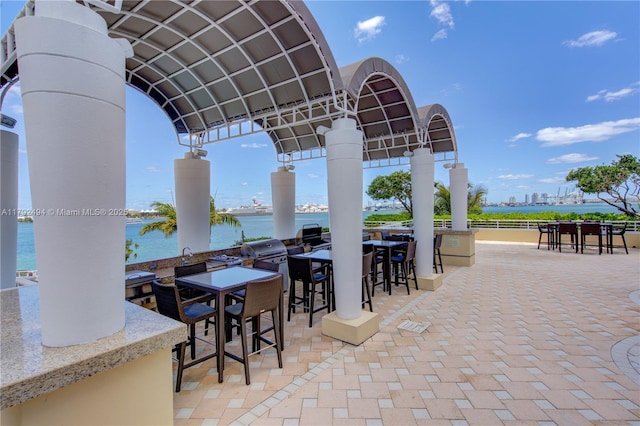 808 Brickell Key Dr Unit 3007, Miami, FL 33131 - view of patio / terrace with a water view and a grill