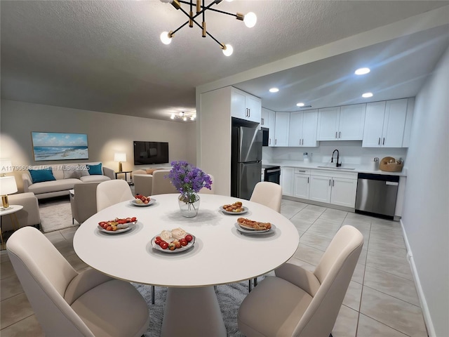 3089 E Yarmouth E Unit 3089, Boca Raton, FL 33434 - dining area with light tile patterned flooring, a chandelier, recessed lighting, and a textured ceiling