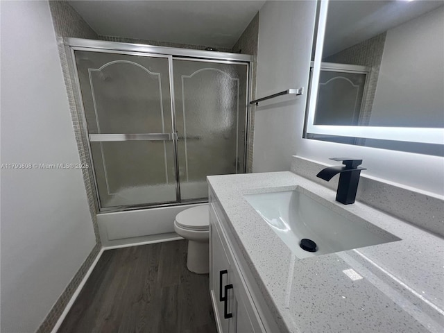 3089 E Yarmouth E Unit 3089, Boca Raton, FL 33434 - full bathroom with vanity, wood finished floors, and shower / bath combination with glass door