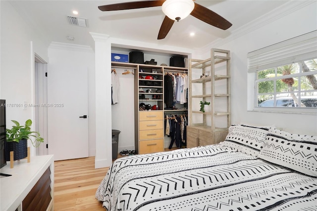 7864 SW 179th Ter, Palmetto Bay, FL 33157 - bedroom with light wood-type flooring, visible vents, ornamental molding, and a closet
