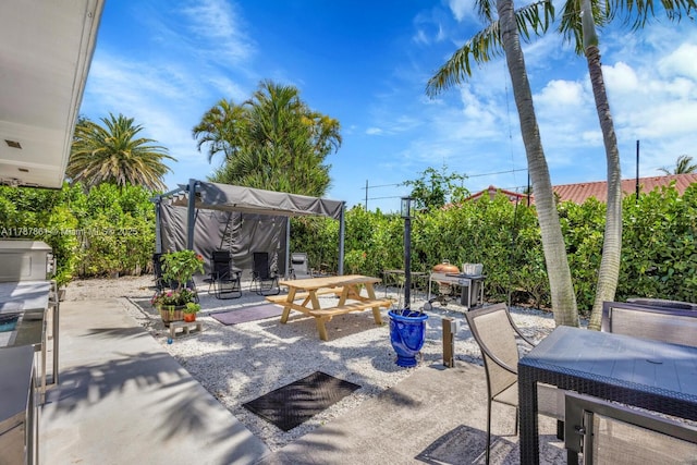 7864 SW 179th Ter, Palmetto Bay, FL 33157 - view of patio featuring fence and outdoor dining area