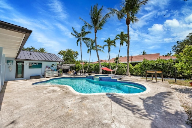 7864 SW 179th Ter, Palmetto Bay, FL 33157 - view of pool featuring a patio and a pool with connected hot tub