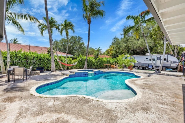 7864 SW 179th Ter, Palmetto Bay, FL 33157 - view of pool featuring a patio and a pool with connected hot tub