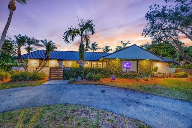 7864 SW 179th Ter, Palmetto Bay, FL 33157 - view of front of property with stucco siding, metal roof, and a standing seam roof