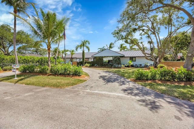 7864 SW 179th Ter, Palmetto Bay, FL 33157 - single story home featuring metal roof, a front yard, and aphalt driveway