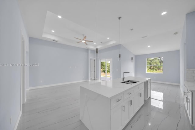 516 Millcreek St, Lehigh Acres, FL 33974 - kitchen with a sink, baseboards, and open floor plan